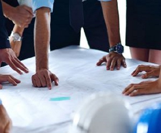 Apex Geosolution team disussion and looking at a map